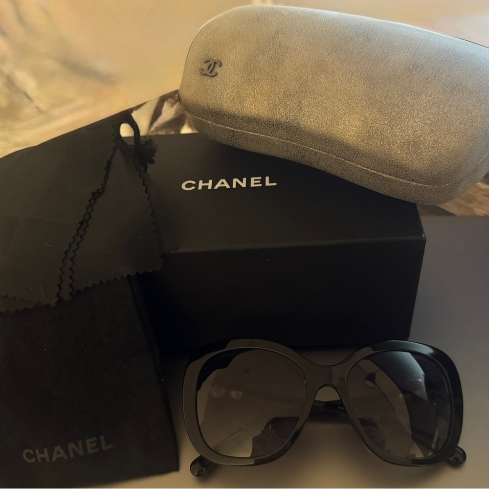 CHANEL Elegant Black Sunglasses with Silver Case